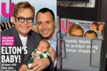 O revistă pe a cărei copertă apar Elton John, soţul său şi bebeluşul cuplului, ...