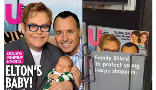 O revistă pe a cărei copertă apar Elton John, soţul său şi bebeluşul cuplului, ...